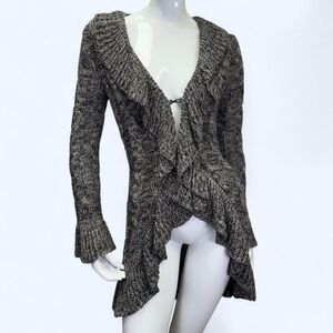 marled cable knit cardigan featuring a dramatic ruffled hem,flared bell sleeves.